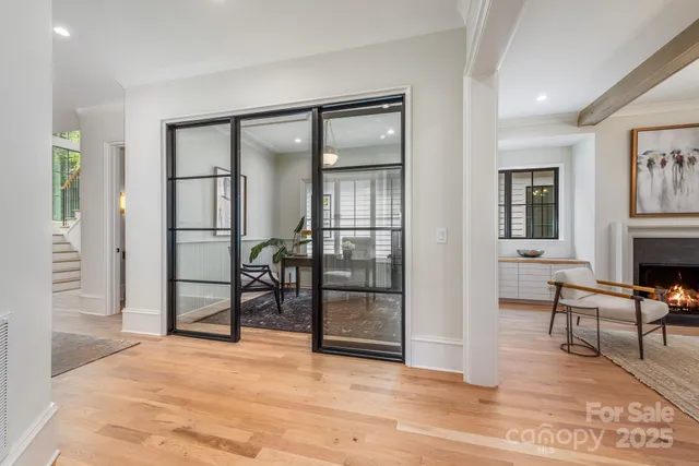 a view of a livingroom with furniture and a fireplace