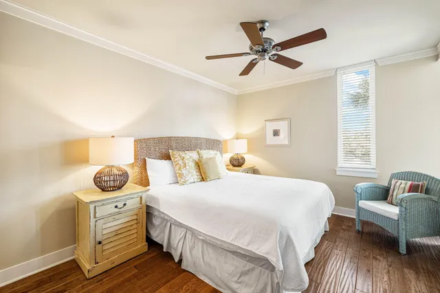 a bedroom with a bed a couch and a window