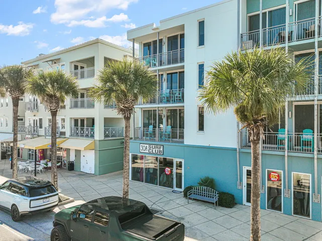a view of a swimming pool with an outdoor seating