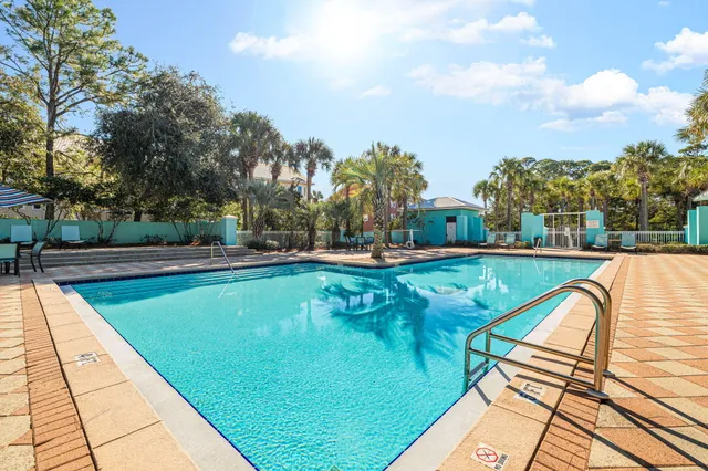 a view of a swimming pool with a lounge chairs