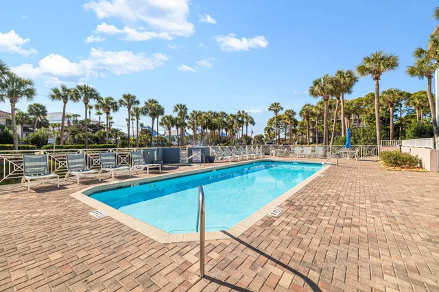 a view of a swimming pool with a lounge chairs
