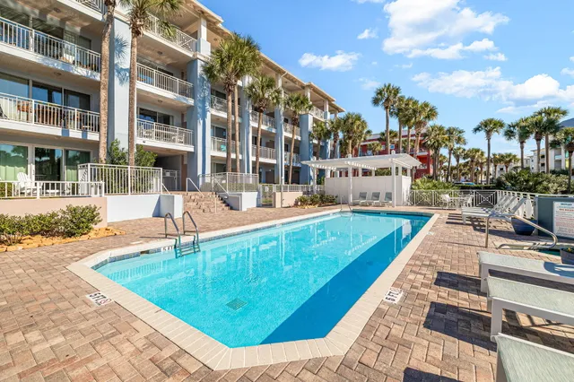 a view of a swimming pool with a patio
