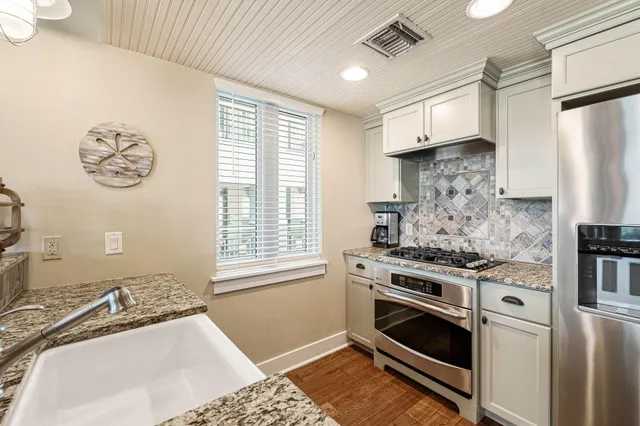 a kitchen with a stove and a refrigerator