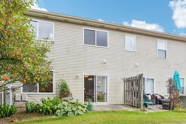 a view of a house with backyard