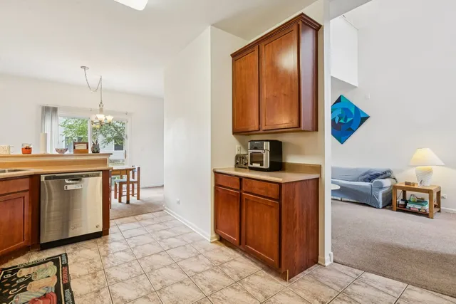 a kitchen with a refrigerator cabinets and a sink