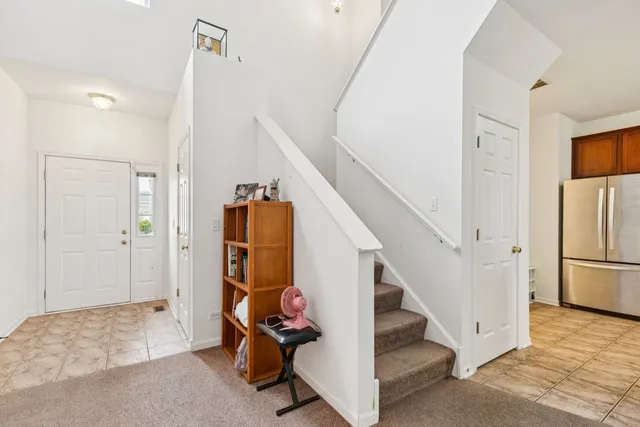 a view of entryway and hall with a couch