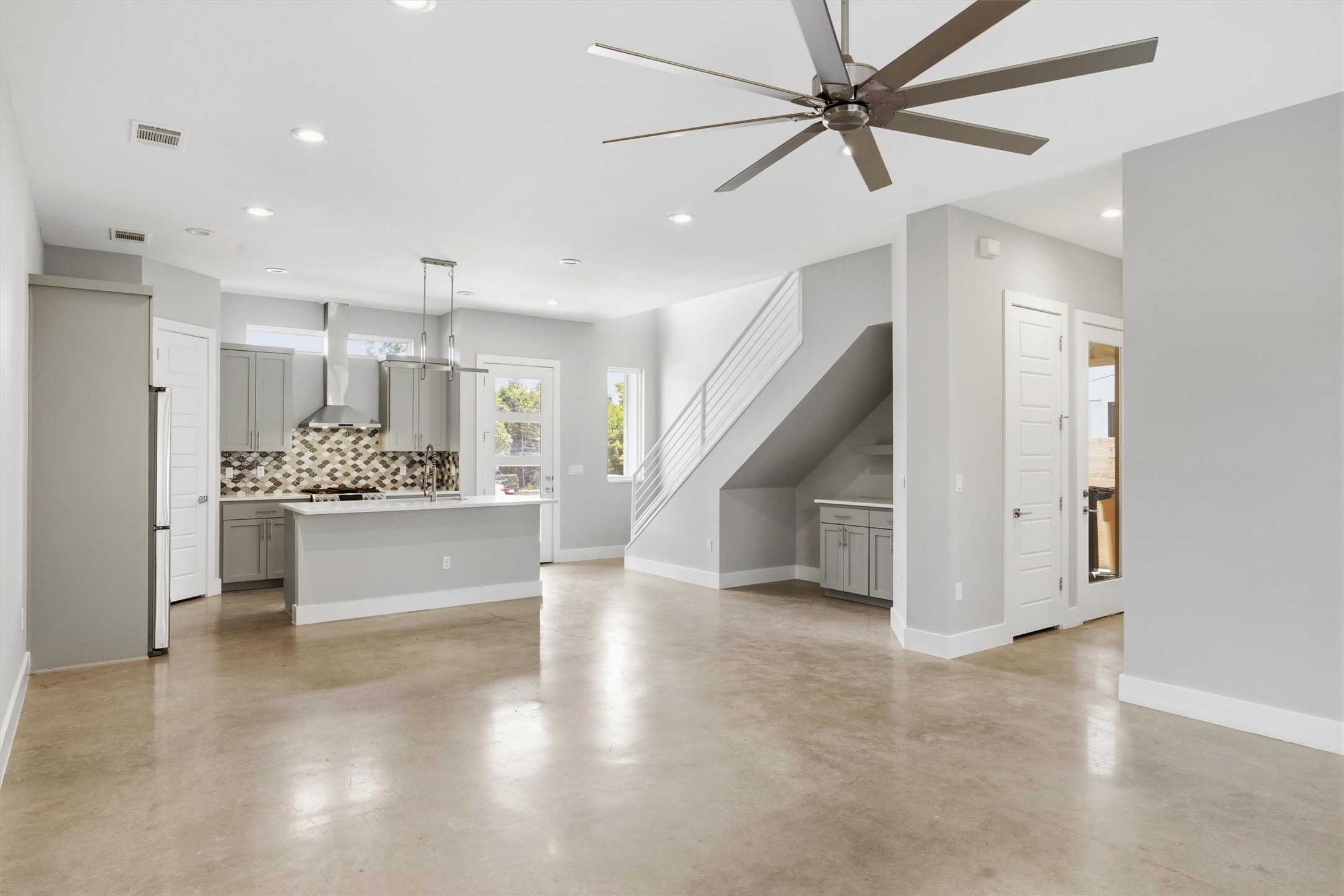 1210 Stobaugh Street, Unit B Austin, TX 78757 - Photo 39 of 40 An open floorplan seamlessly connects the kitchen and living areas, offering effortless movement throughout.