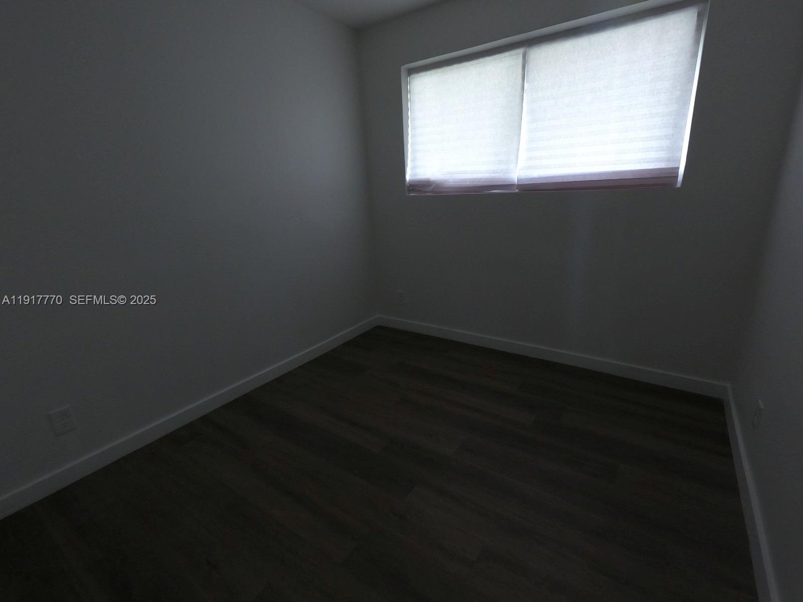 26633 Southwest 138th Court Homestead, FL 33032 - Photo 30 of 58 a view of a small space with wooden floor and a window