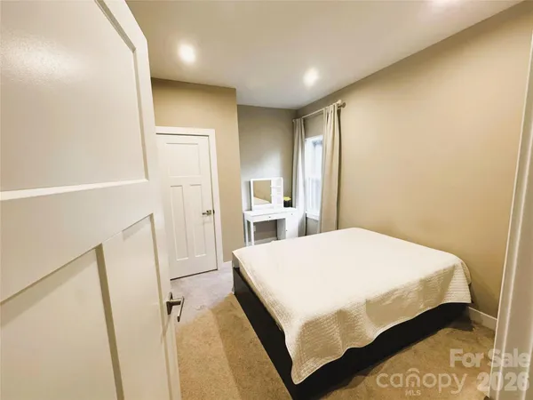 a bathroom with a sink mirror toilet and shower