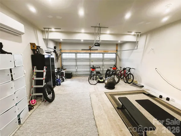 a view of an empty room with windows