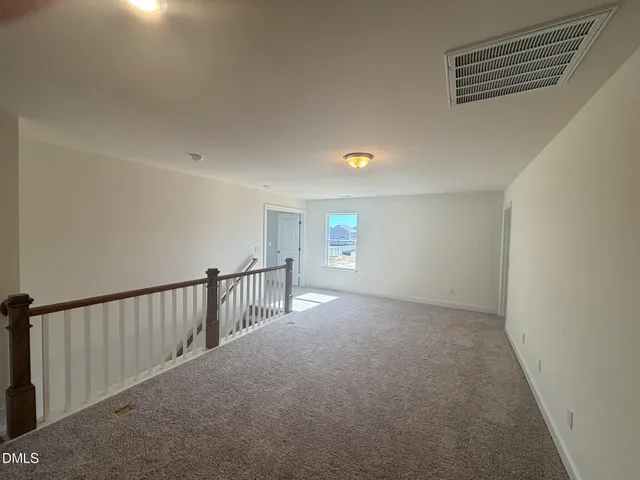 a view of a hallway with staircase
