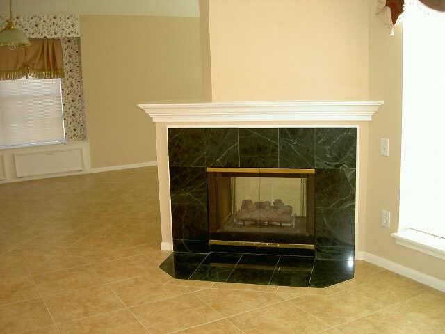 4542 Springfield Lakes Street Sugar Land, TX 77479 - Photo 5 of 16 Cozy fireplace with elegant mantel serving as the focal point of the living area.