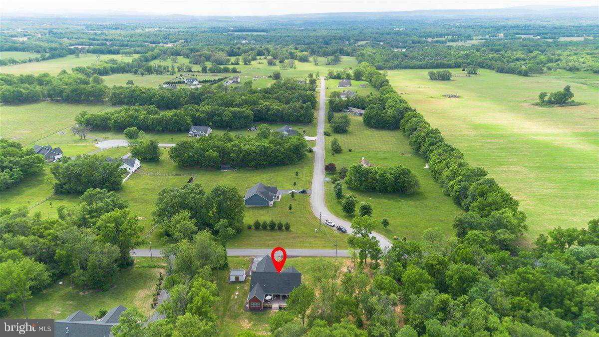 2390 Shirley Road Charles Town, WV 25414 - Photo 2 of 69 an aerial view of green landscape with trees houses and lake view