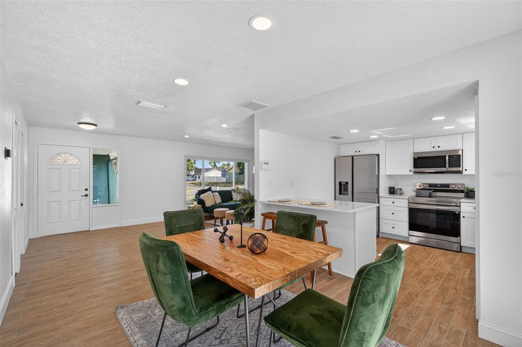 3733 Coppertree Circle Brandon, FL 33511 - Photo 11 of 45 a view of a dining room with furniture and wooden floor