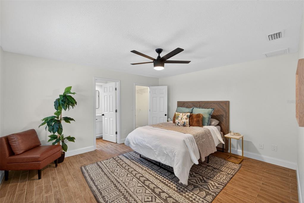 3733 Coppertree Circle Brandon, FL 33511 - Photo 14 of 45 a bedroom with a bed and a couch