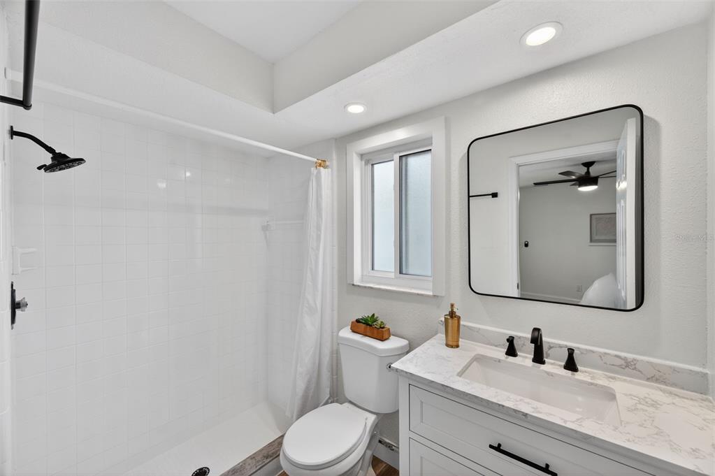 3733 Coppertree Circle Brandon, FL 33511 - Photo 19 of 45 a bathroom with a toilet a sink a tub and mirror