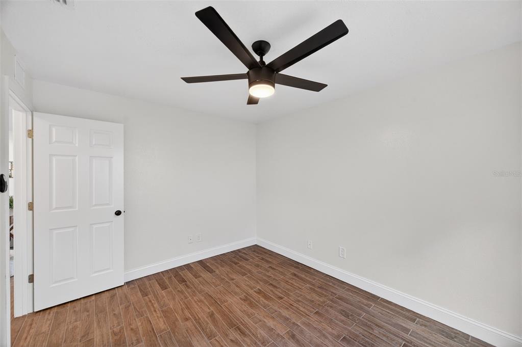3733 Coppertree Circle Brandon, FL 33511 - Photo 23 of 45 a view of empty room with wooden floor