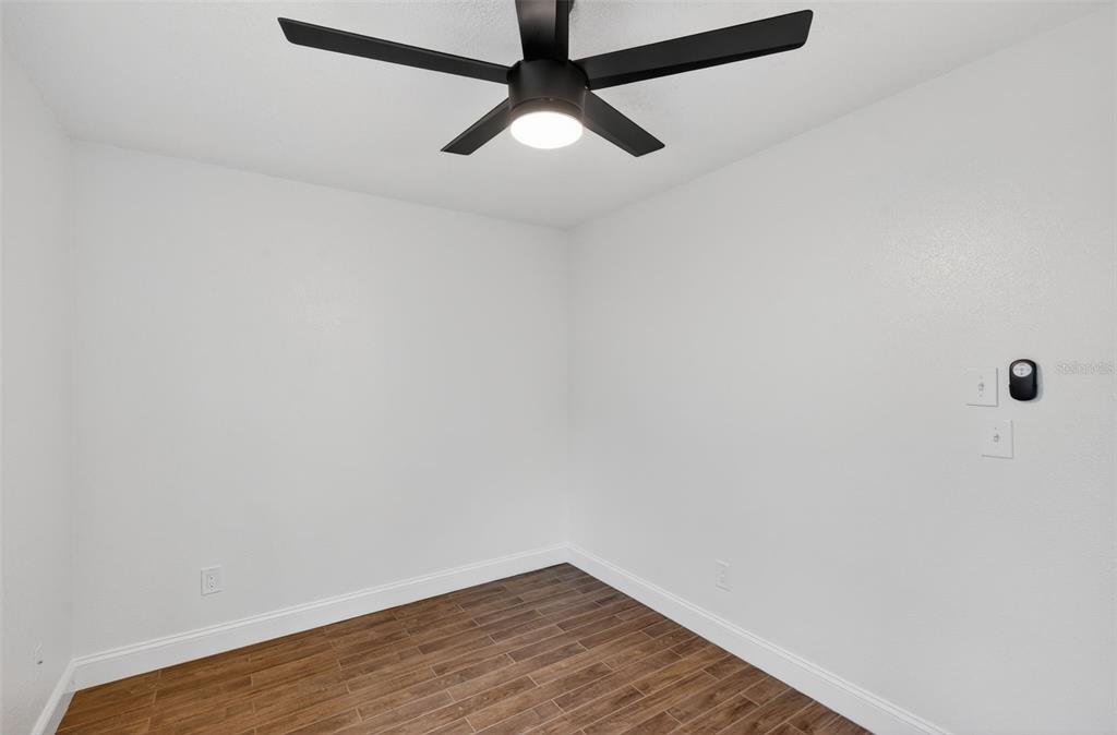 3733 Coppertree Circle Brandon, FL 33511 - Photo 26 of 45 a view of an empty room with wooden floor