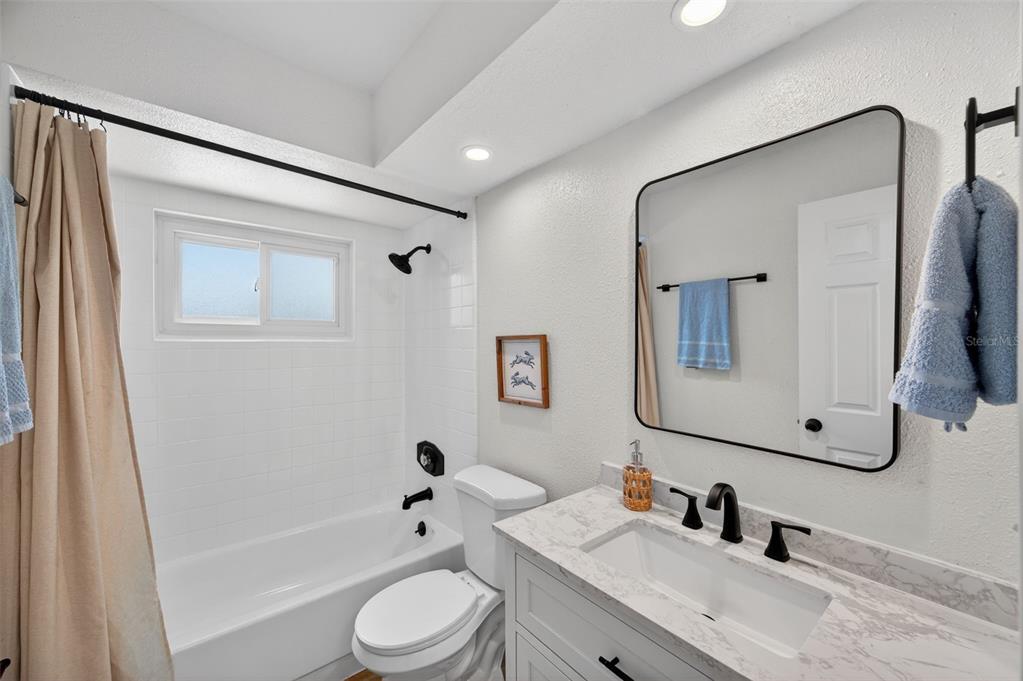 3733 Coppertree Circle Brandon, FL 33511 - Photo 29 of 45 a bathroom with a bathtub shower sink and mirror