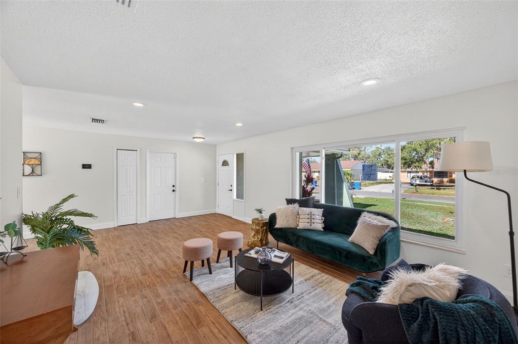 3733 Coppertree Circle Brandon, FL 33511 - Photo 4 of 45 a living room with furniture and a potted plant