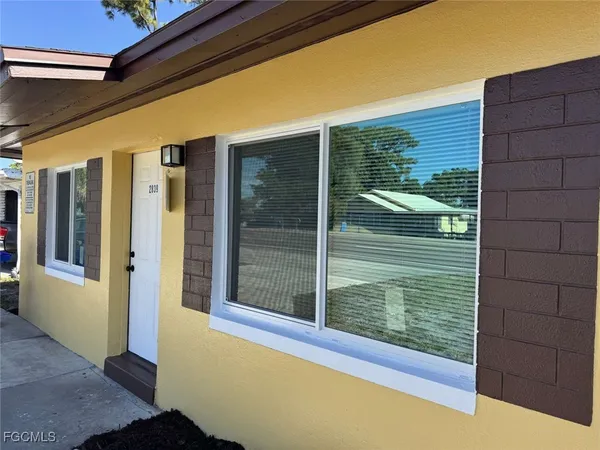 a view of a door and a window