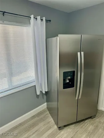 a view of a refrigerator in kitchen and a refrigerator