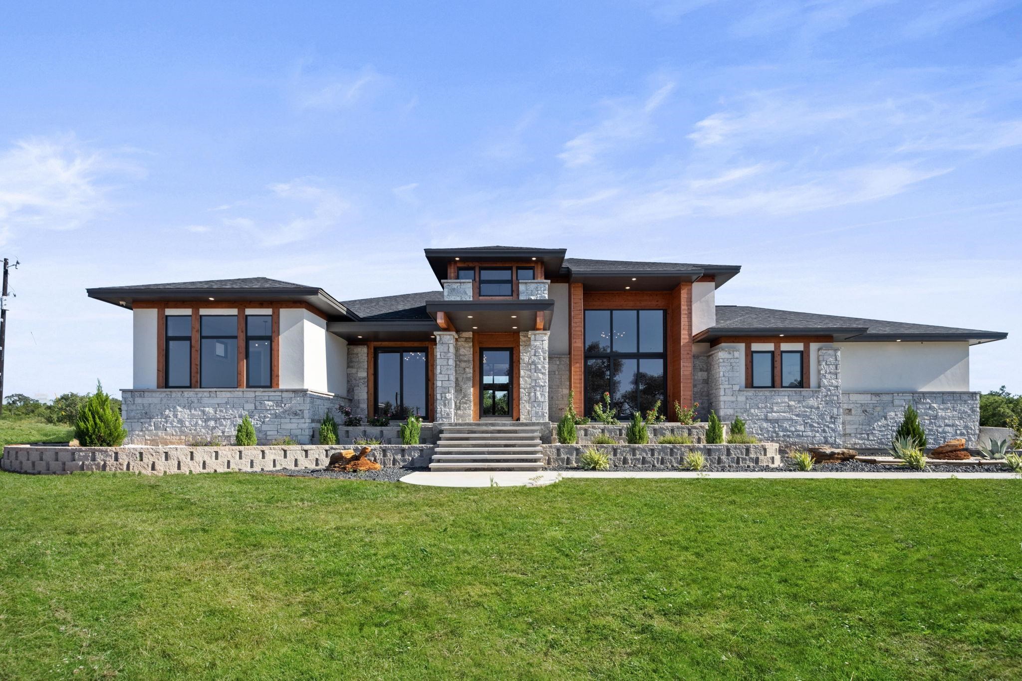 a front view of a house with a yard