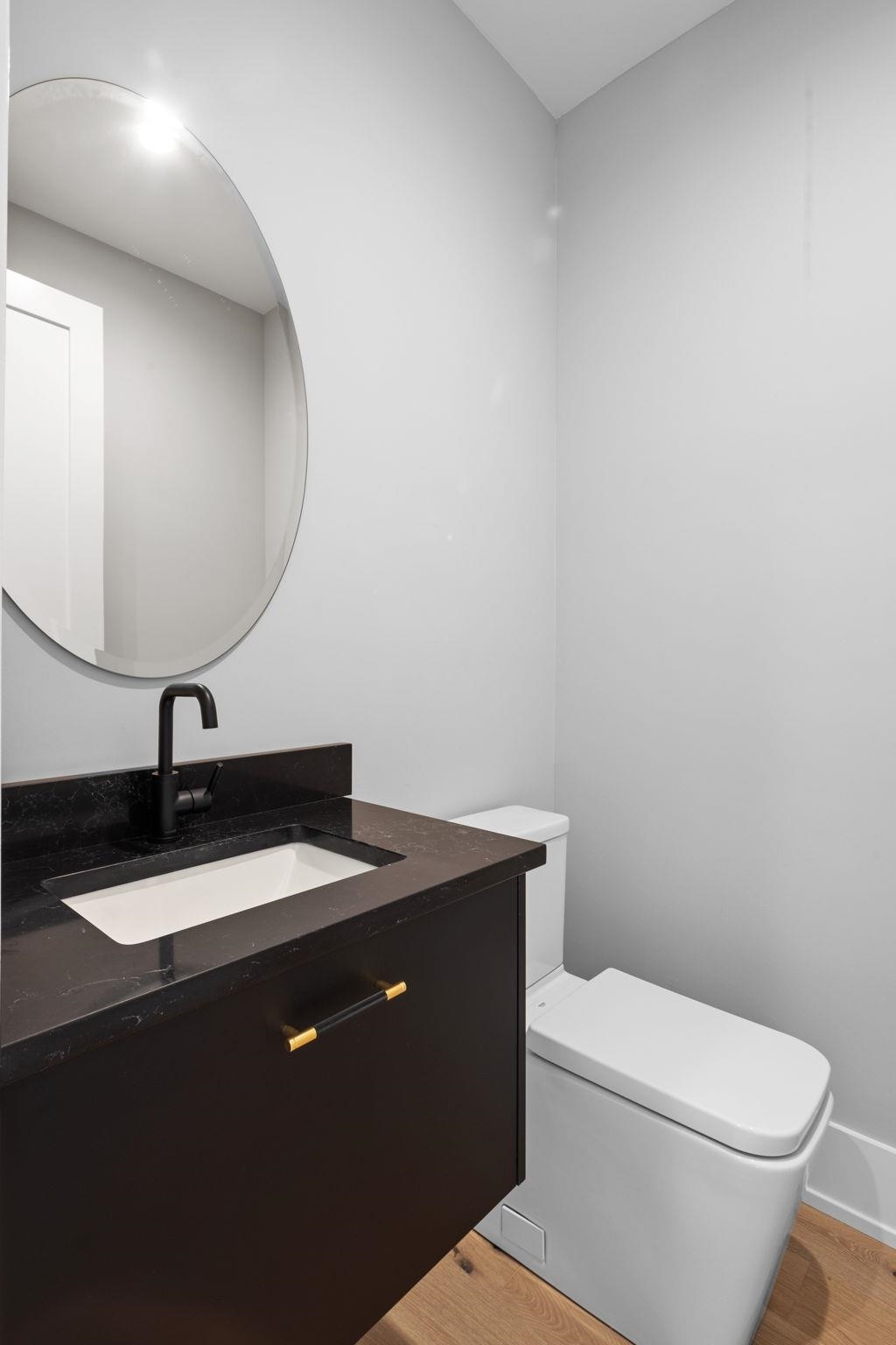583 Comanche Ridge Round Mountain, TX 78663 - Photo 14 of 30 a bathroom with a granite countertop sink and a toilet