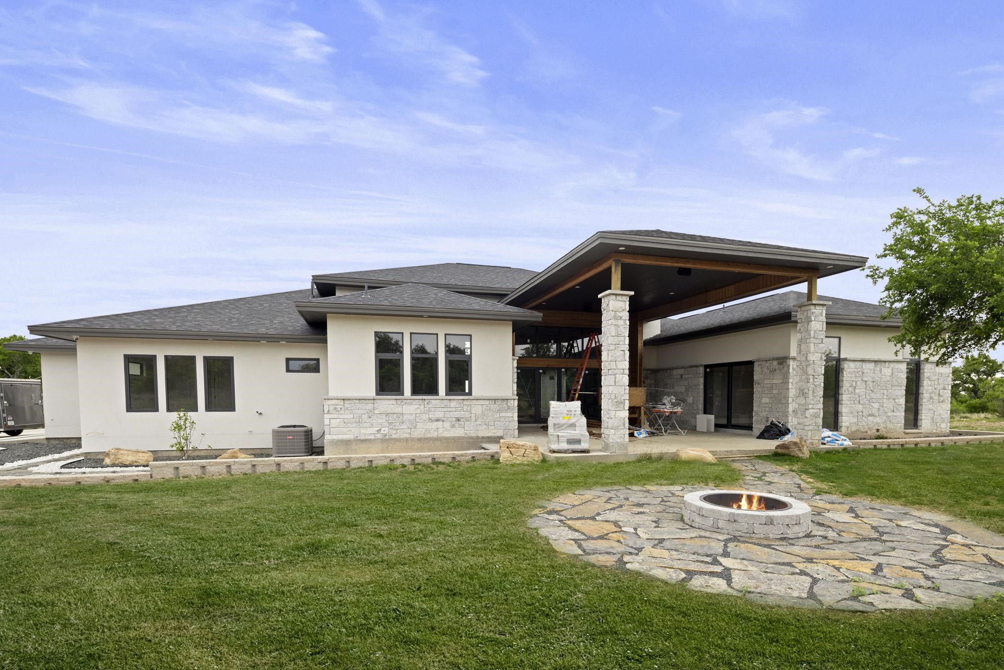 583 Comanche Ridge Round Mountain, TX 78663 - Photo 4 of 30 a front view of house with yard and green space