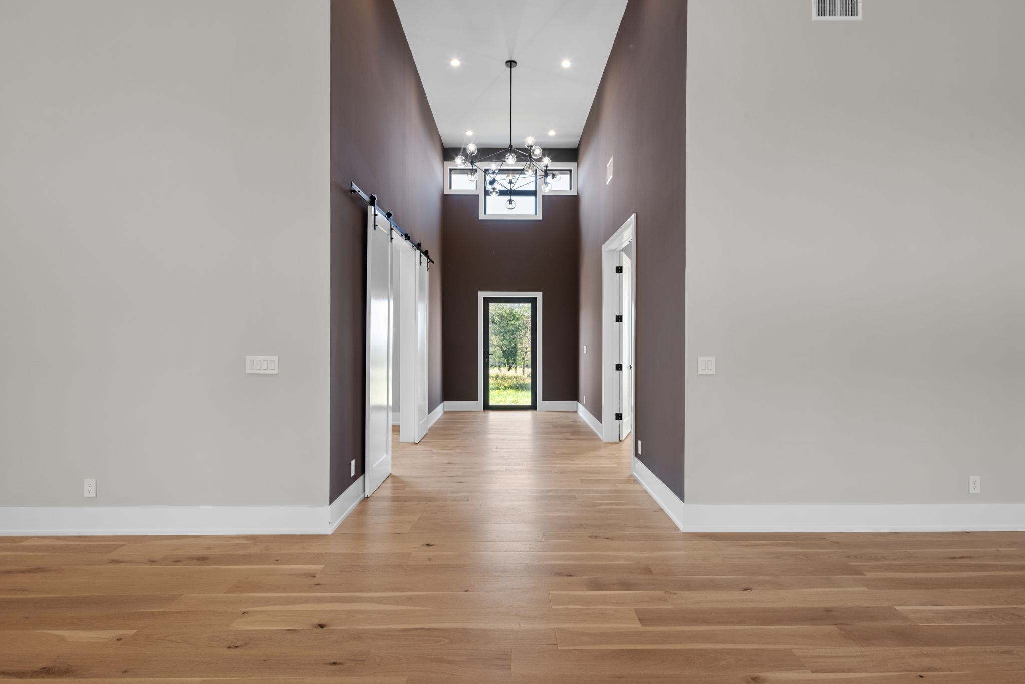 583 Comanche Ridge Round Mountain, TX 78663 - Photo 5 of 30 a view of a chandelier in a room with a chandelier