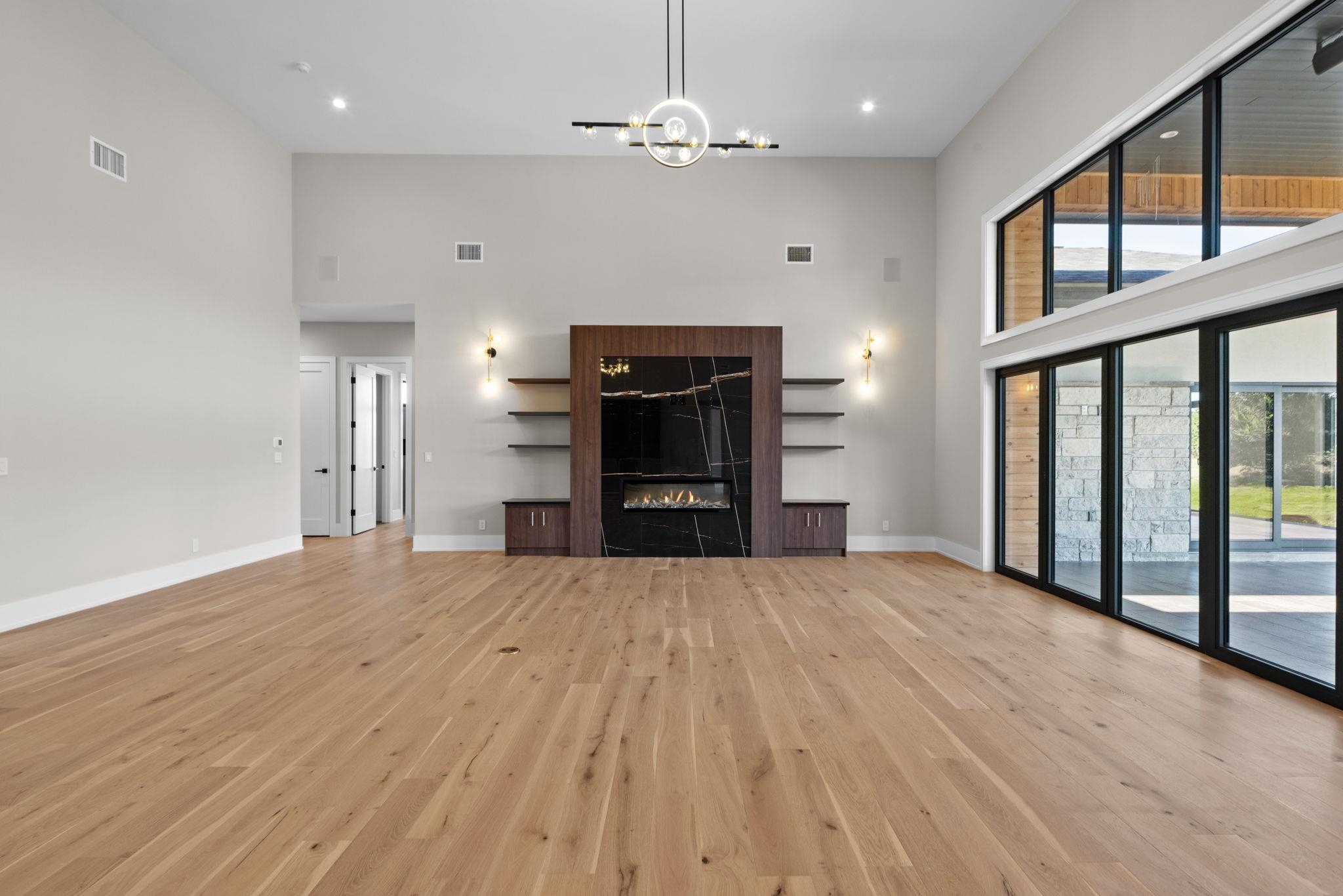 583 Comanche Ridge Round Mountain, TX 78663 - Photo 8 of 30 a view of an empty room with a window and kitchen view