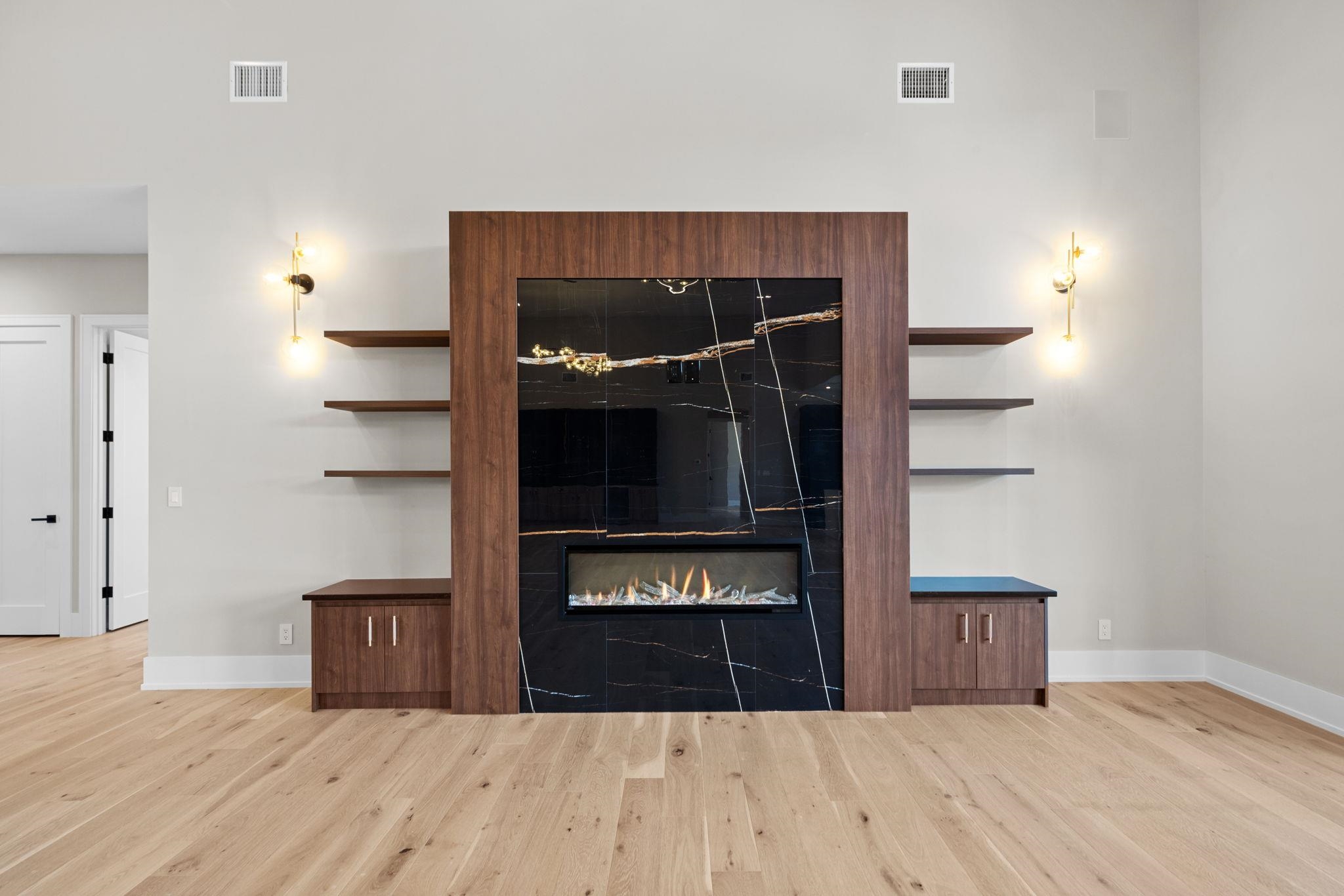 583 Comanche Ridge Round Mountain, TX 78663 - Photo 9 of 30 a living room with wooden floor and furniture