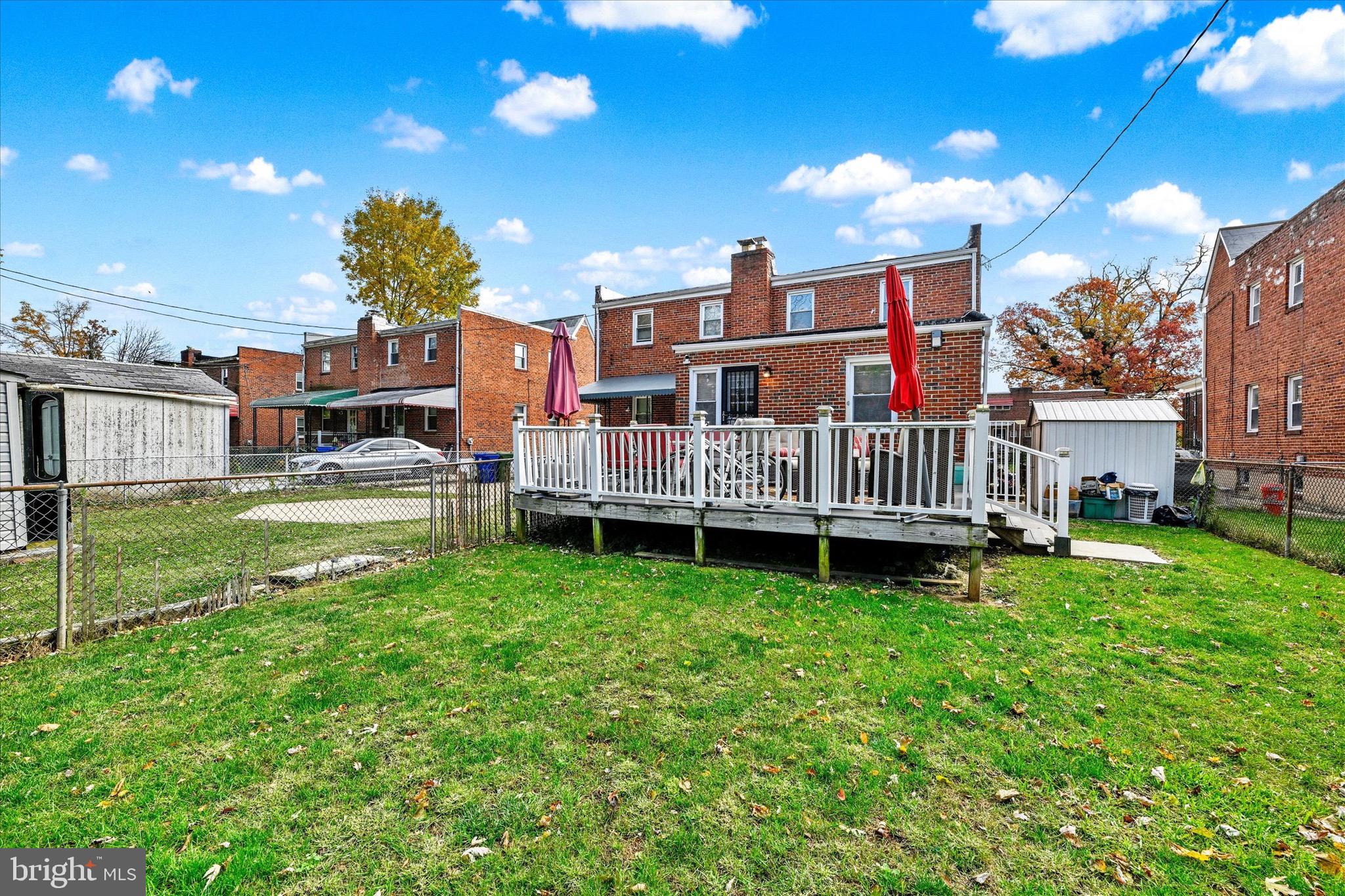 3922 Mortimer Avenue Baltimore, MD 21215 - Photo 26 of 27 a view of a garden with a house in the background
