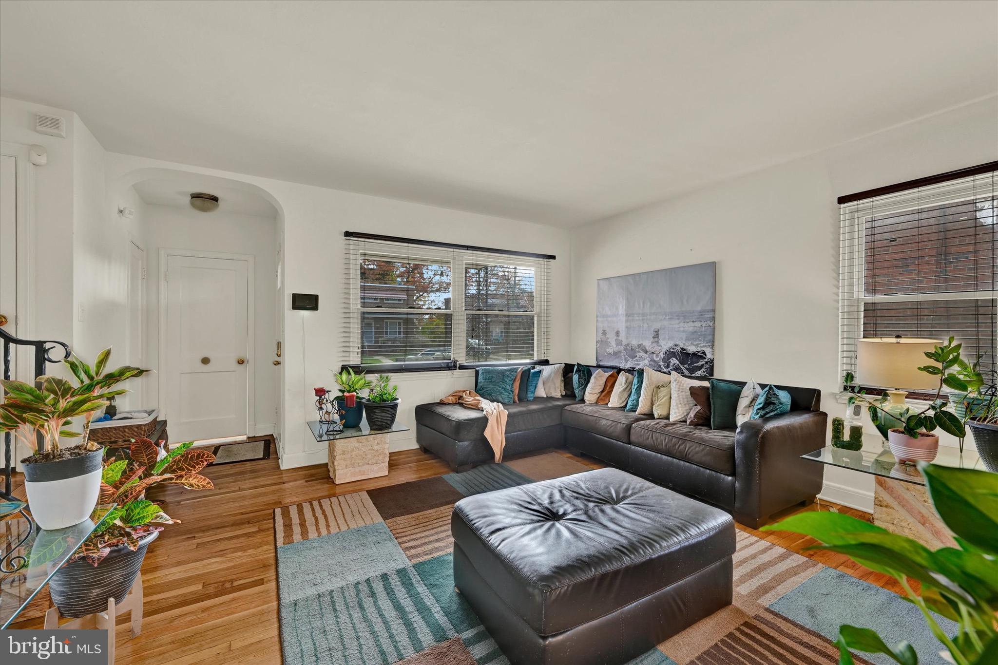 3922 Mortimer Avenue Baltimore, MD 21215 - Photo 3 of 27 a living room with furniture and a large window
