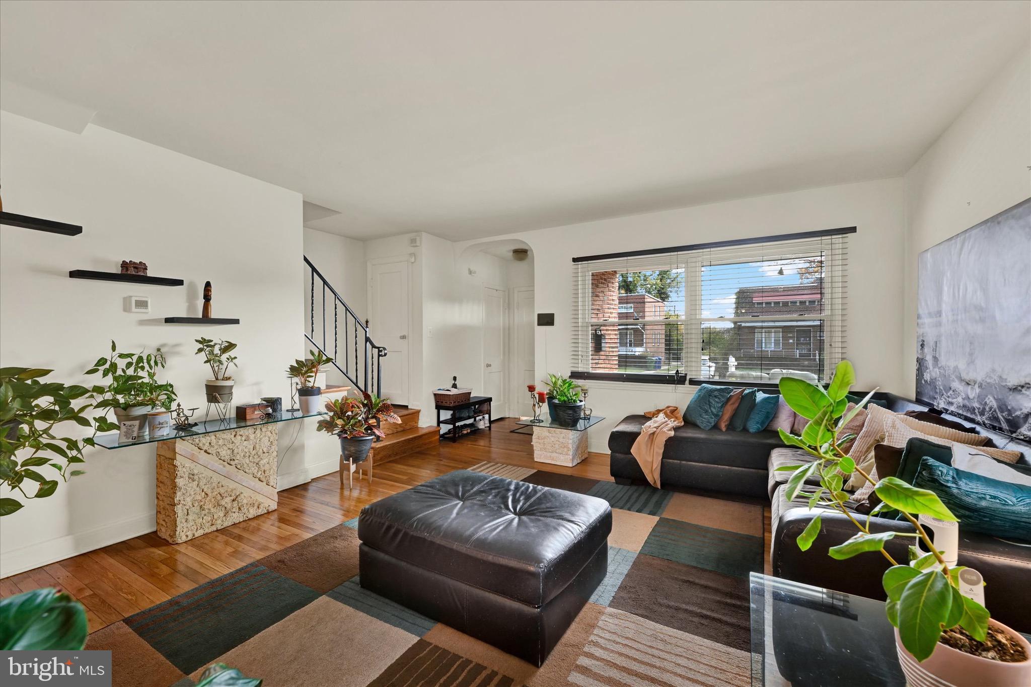 3922 Mortimer Avenue Baltimore, MD 21215 - Photo 4 of 27 a living room with furniture and a large window