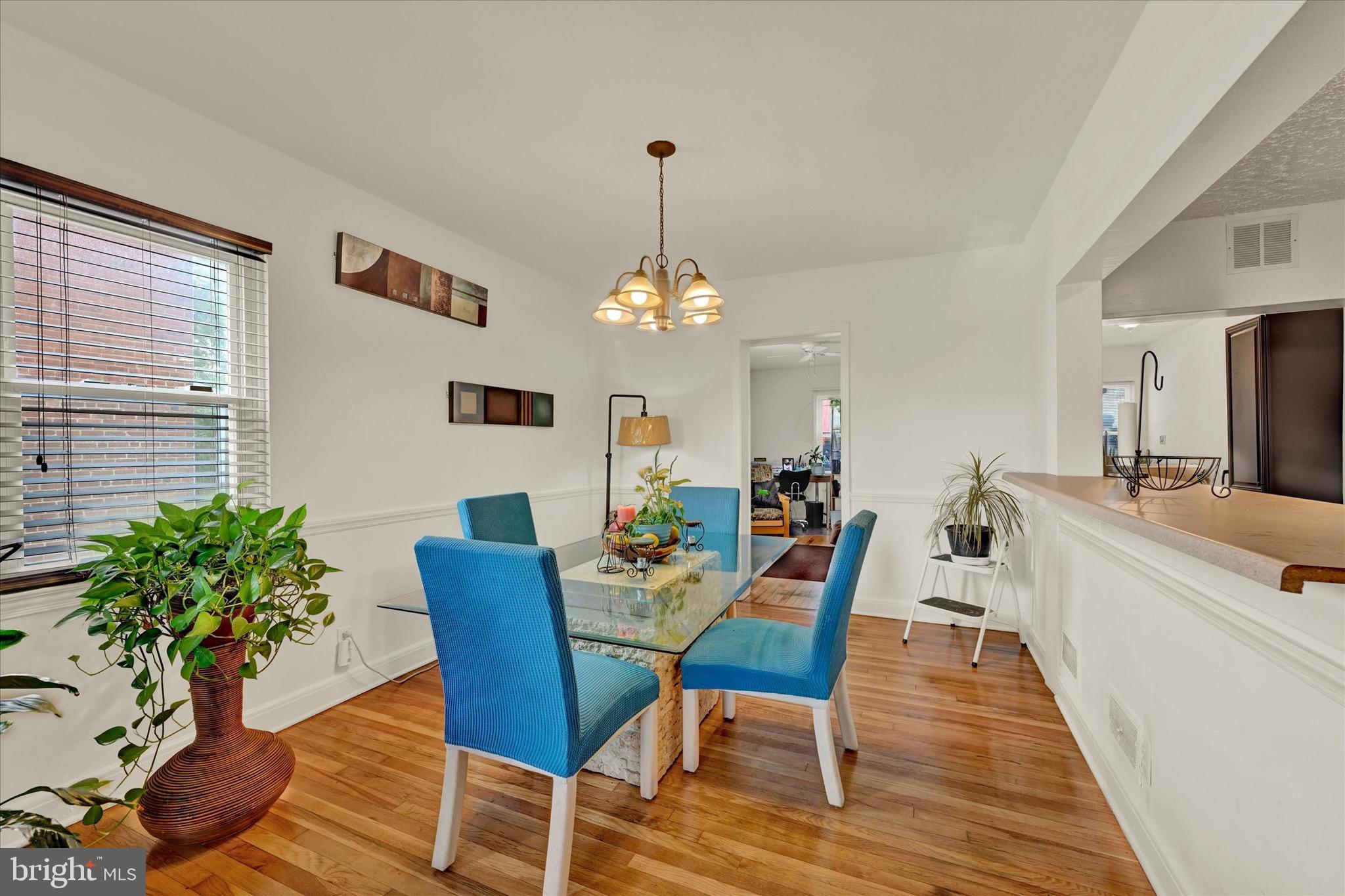 3922 Mortimer Avenue Baltimore, MD 21215 - Photo 6 of 27 a view of a dining room with furniture window and wooden floor