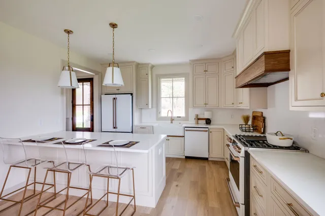 a view of small space with wooden floor and window