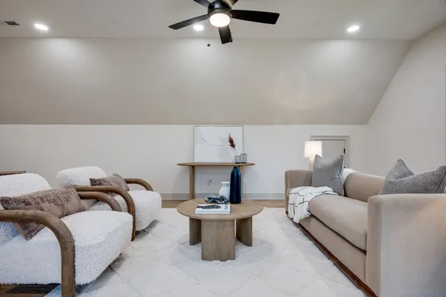 a spacious bathroom with a double vanity sink a mirror and shower
