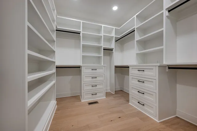 a living room with furniture and a large mirror