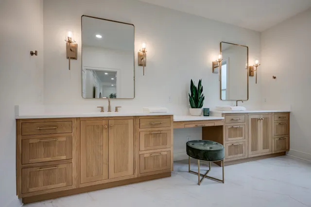 a bathroom with a double vanity sink and mirror