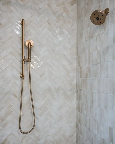 an empty room with ceiling fan and windows