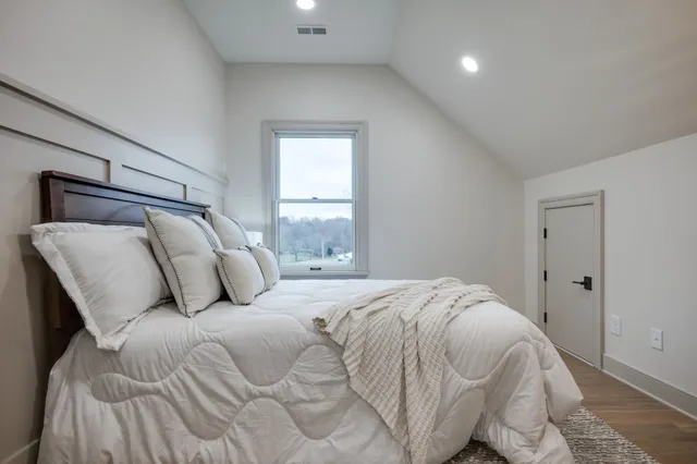 a front view of house with a garden and patio