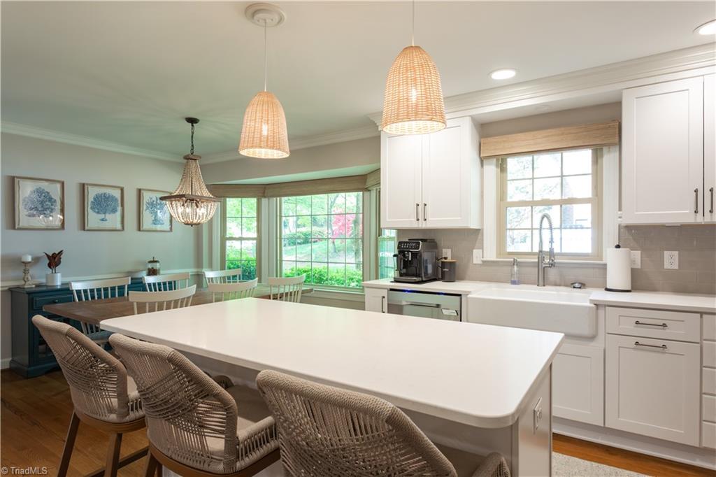 4200 Hobbs Road Greensboro, NC 27410 - Photo 13 of 36 Sunny picture perfect kitchen with eat-in island.