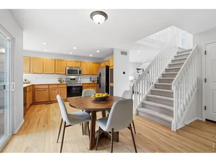 a open kitchen with a table and chairs