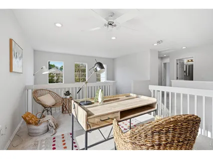 a living room with furniture a table and chairs