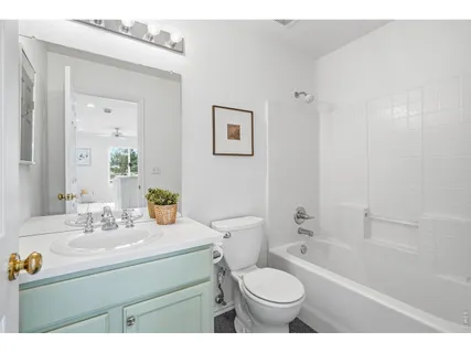 a bathroom with a sink toilet a tub and shower