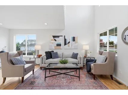 a living room with furniture and a potted plant