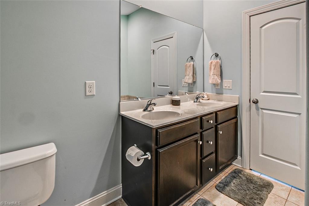 689 Nikyle Circle High Point, NC 27265 - Photo 17 of 33 Owner's bath, ceramic floor, double vanity