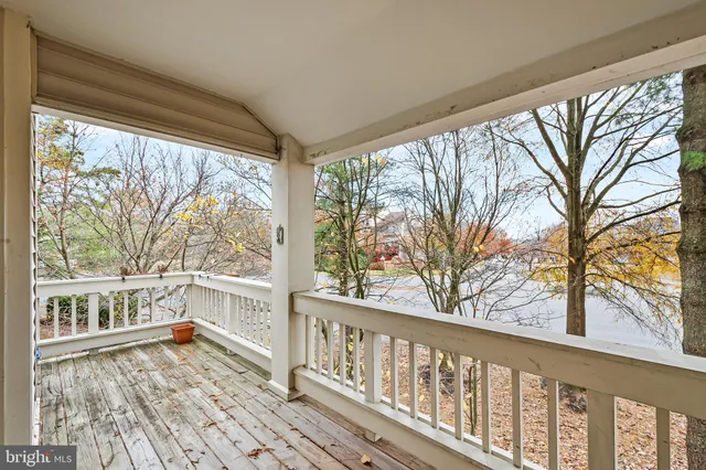 a view of a house with a wooden deck