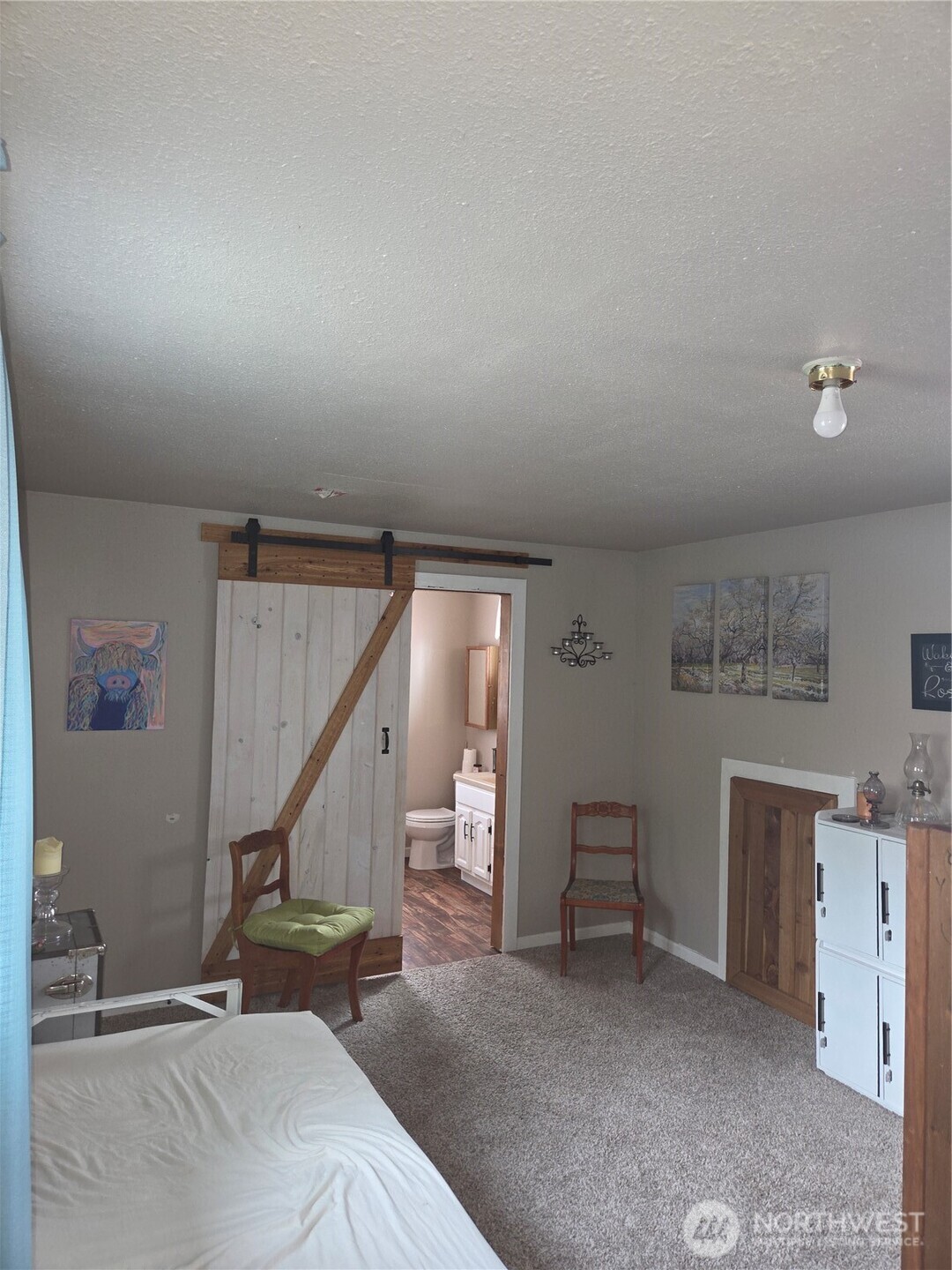 83 East Cayuse Mountain Road Tonasket, WA 98855 - Photo 17 of 37 a view of a livingroom with furniture and stairs